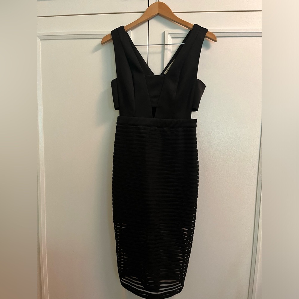 Sleeveless black dress with cutouts size medium